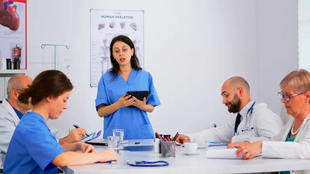 Doctors discussing patient cases during rotations in various medical specialties