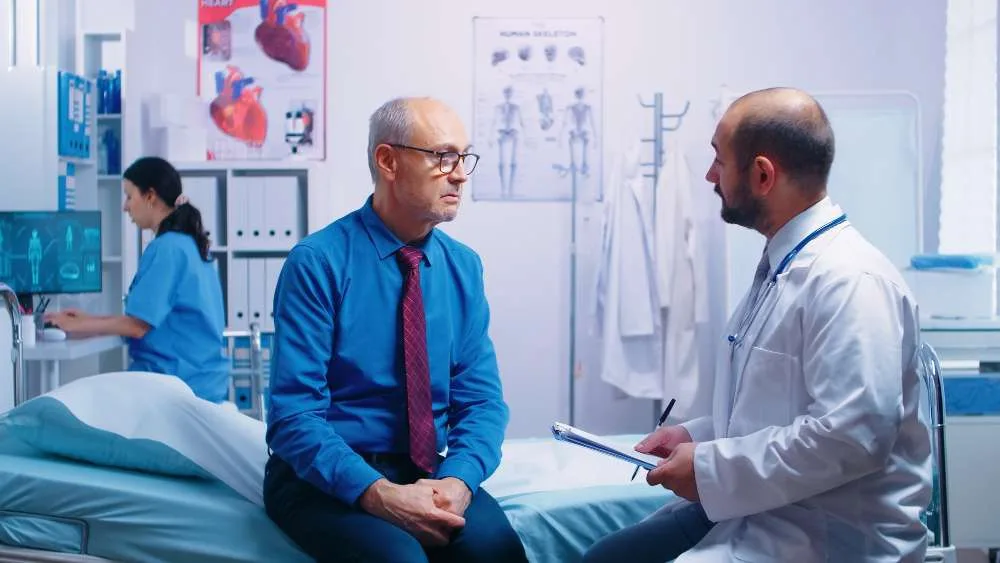 A resident physician engaged in patient care